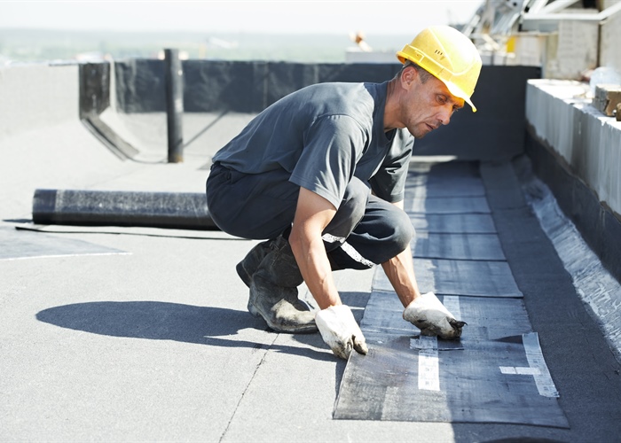 How Twin Cities Weather Impacts Commercial Roof Replacement Timing